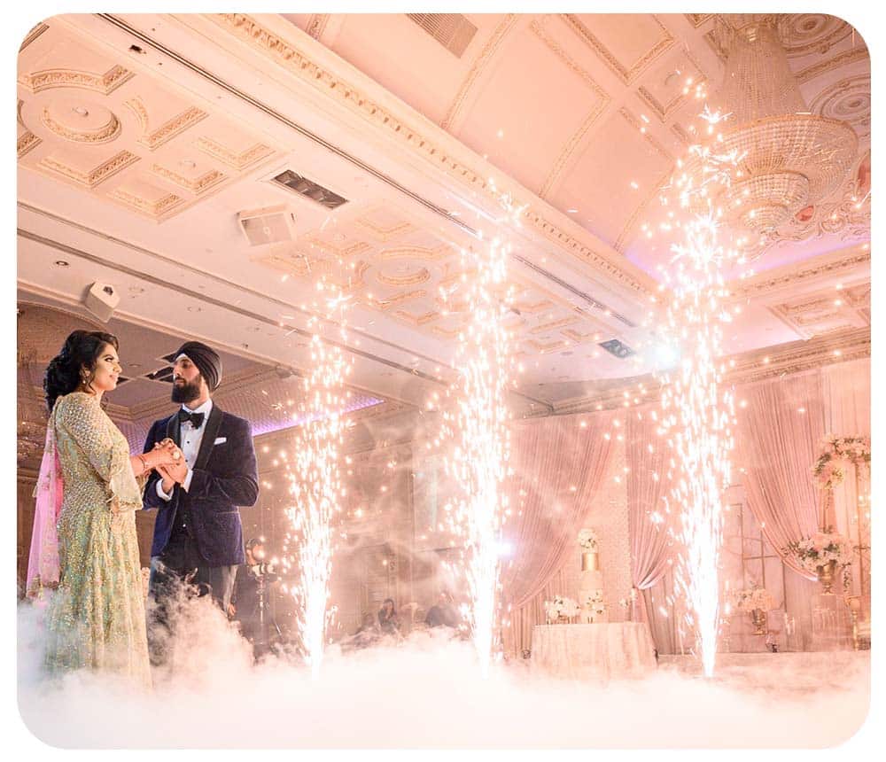 Indian wedding first dance with sparkler effects and fog