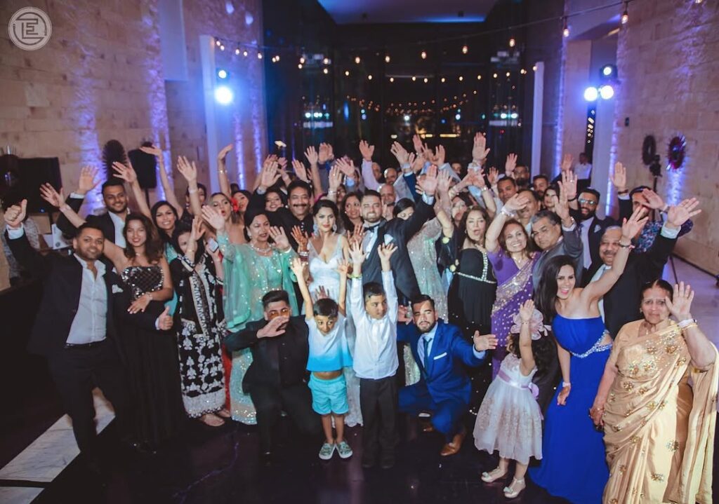 Wedding Guests celebrating in a decorated hallway