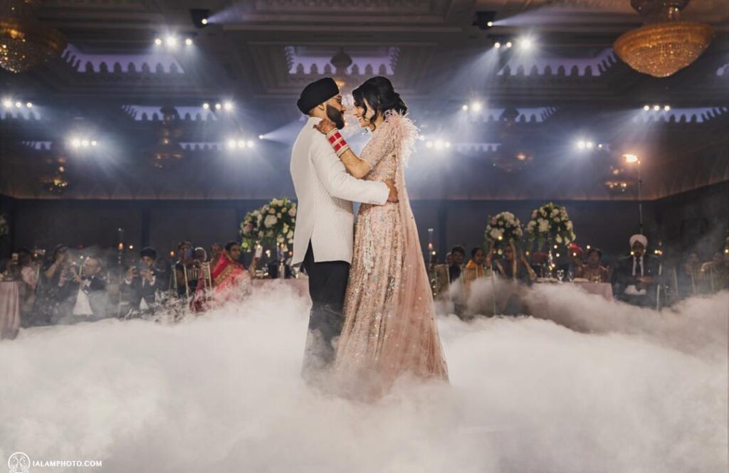 Indian wedding couple's first dance on a cloud effect dance floor