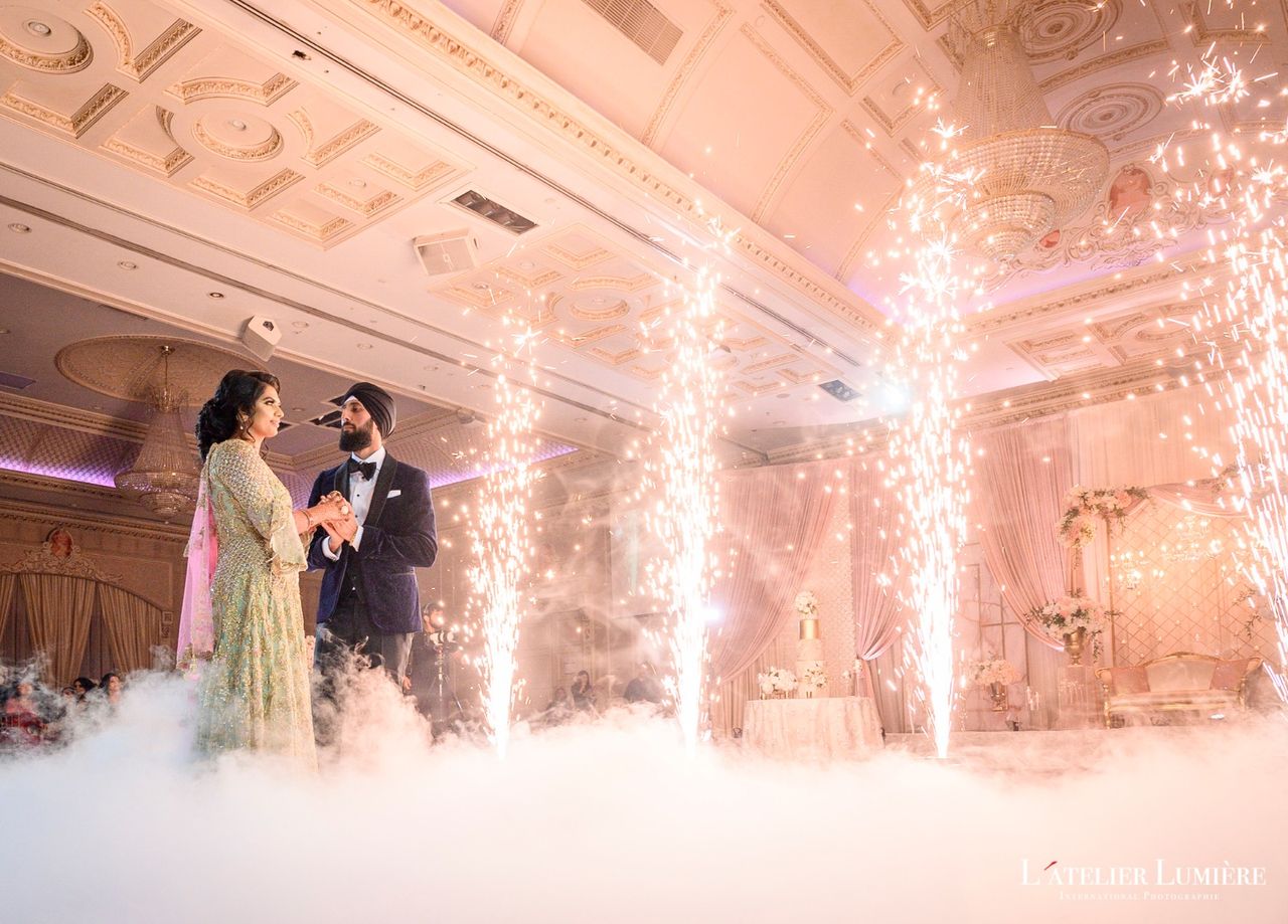 Indian wedding first dance with sparkler effects and fog