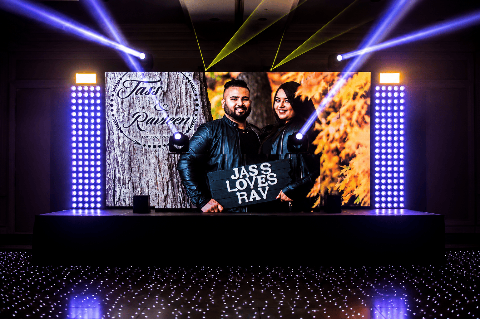 Custom LED wall display with couple's photo at a wedding reception